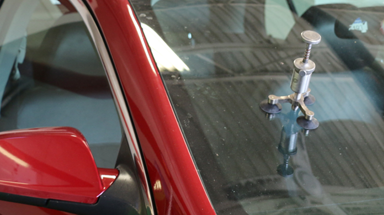 Image of windshield being repaired